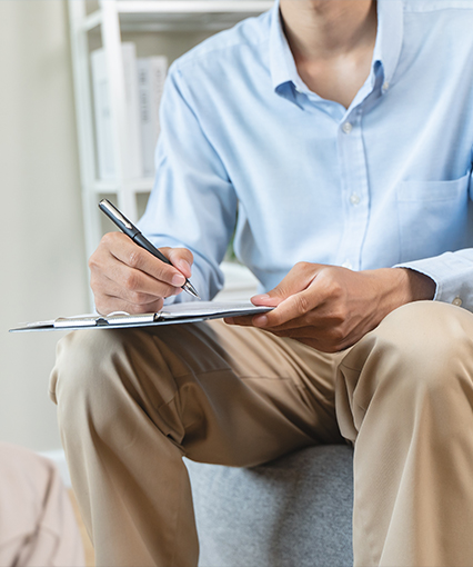 Therapist taking notes in session